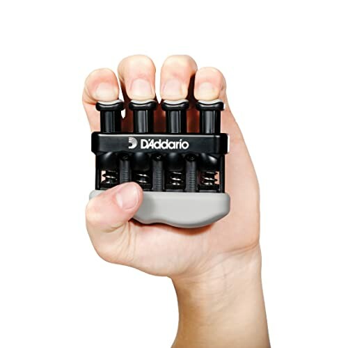 Hand using a D'Addario finger exerciser