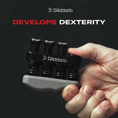 Hand holding D'Addario finger exerciser for dexterity.